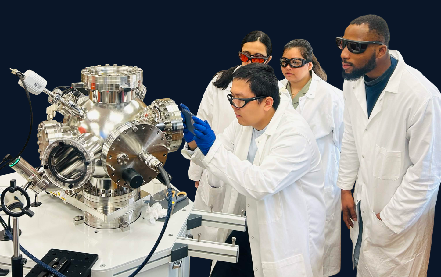 Blue Wave Semiconductors team inspecting a deposition system